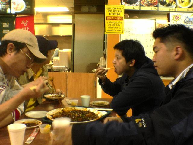 me, han, yush, alex eating some grub at assi shopping plaza in atl