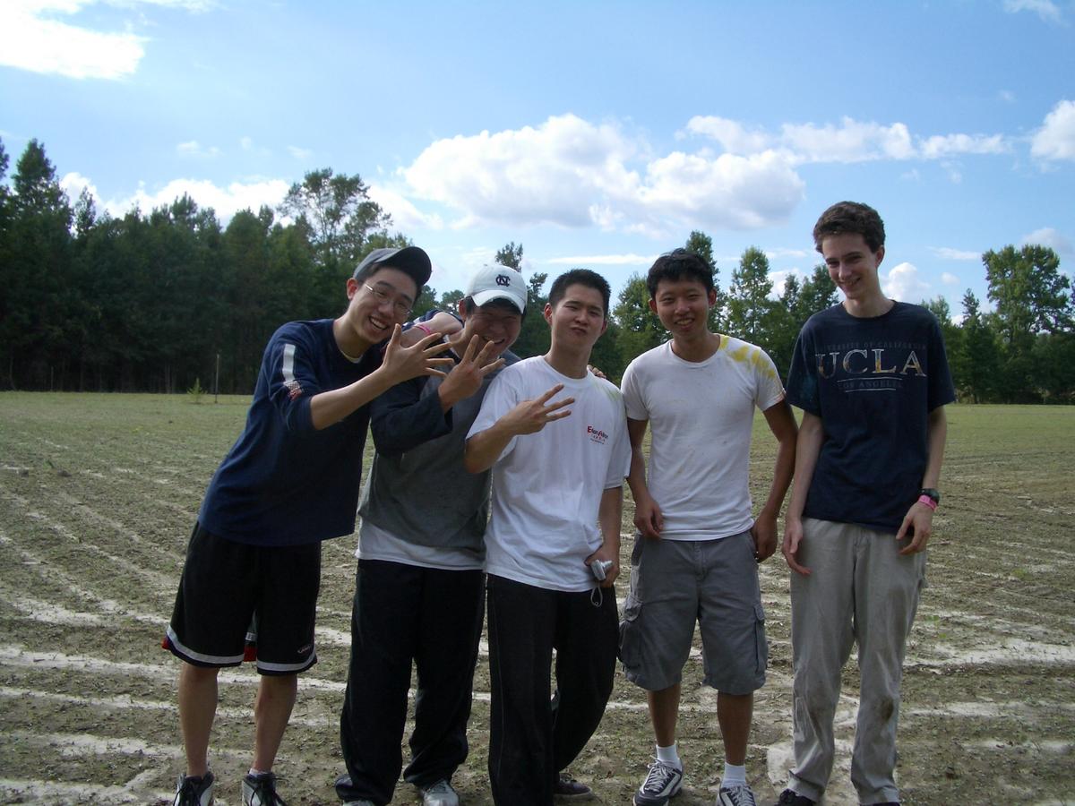 Paintball, 2004. No idea why I'm holding up the number 5.